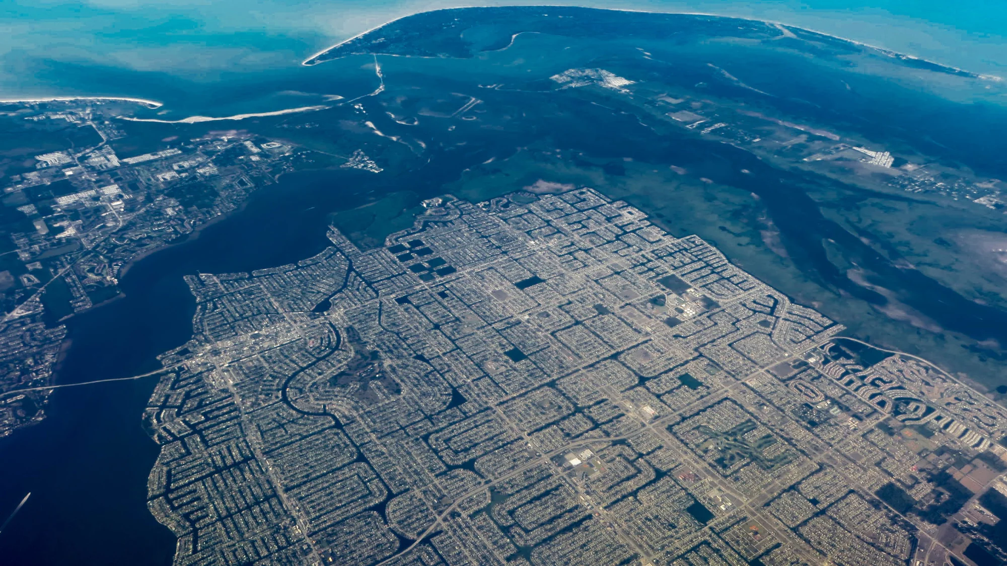 Aerial view of the Cape Coral canal network reaching the Gulf